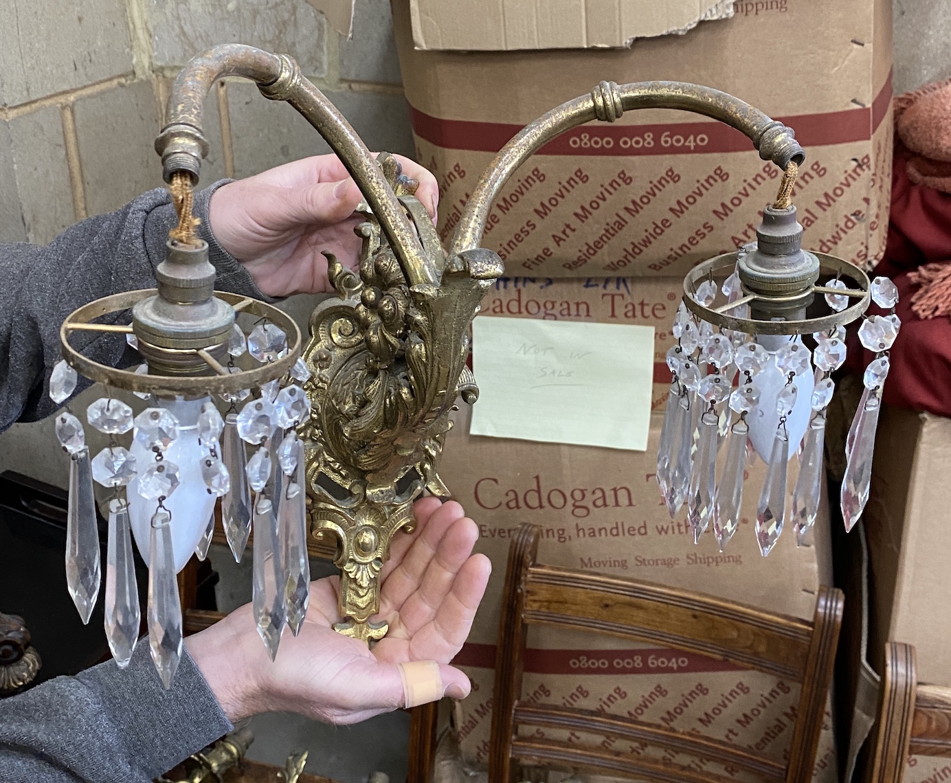 A pair of gilt metal twin branch lustre wall lights and a set of four gilt metal twin branch wall lights, larger height 40cm